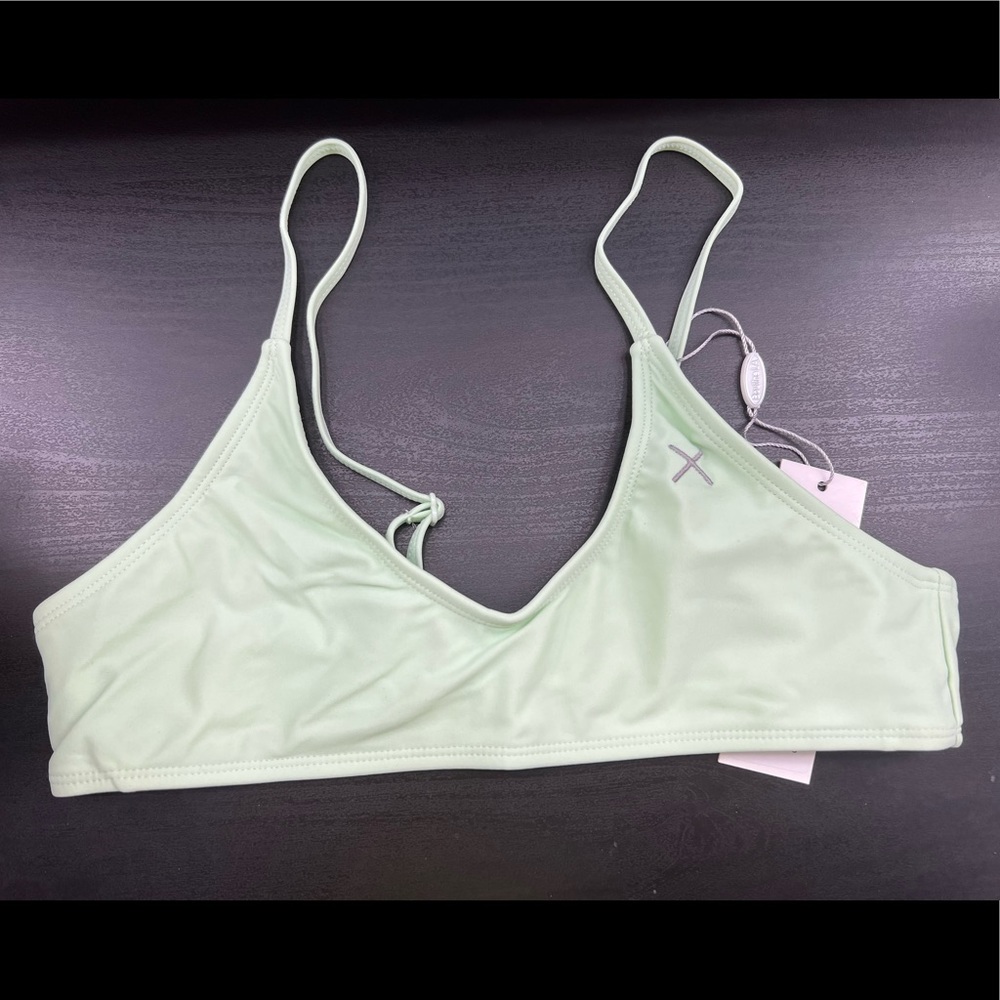 The adjustable top from Boutine LA in the color ocean blue and a size small.